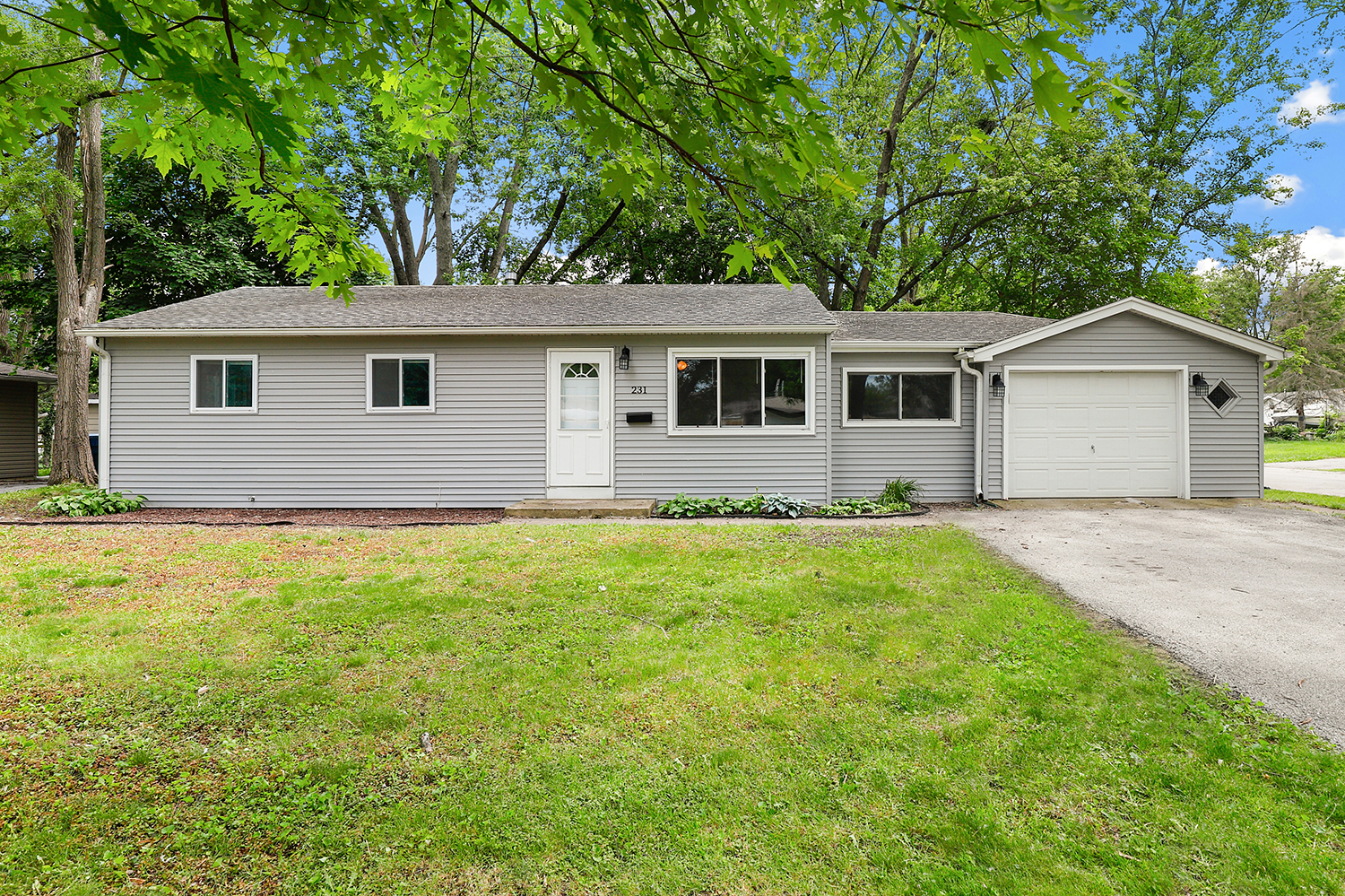 231 West 35th Street Steger, IL 60475 - Photo 1 of 17 a front view of house with yard and trees all around
