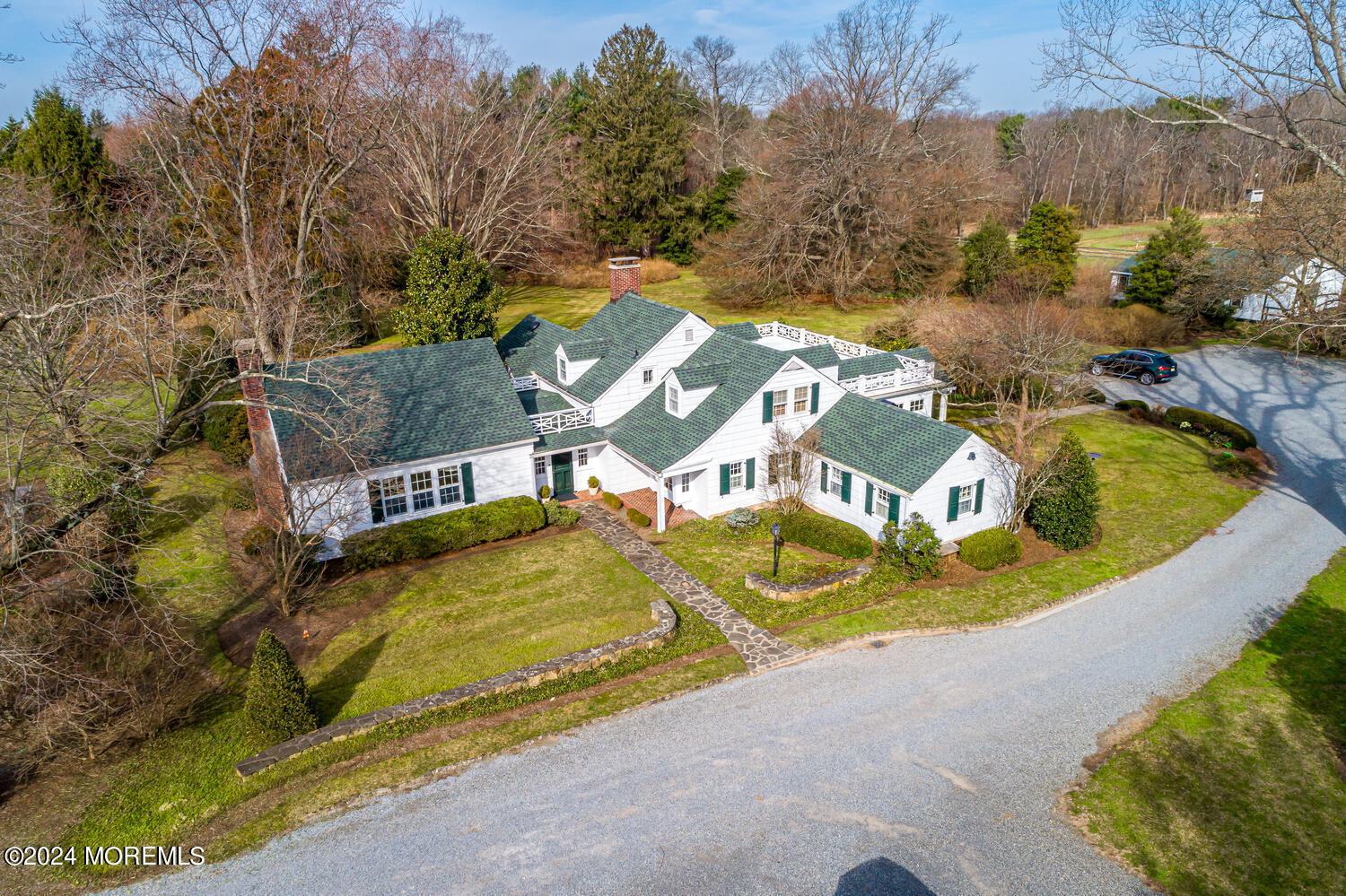 299 County Road 537 Colts Neck, NJ 07722 - Photo 2 of 62 an aerial view of a house with swimming pool