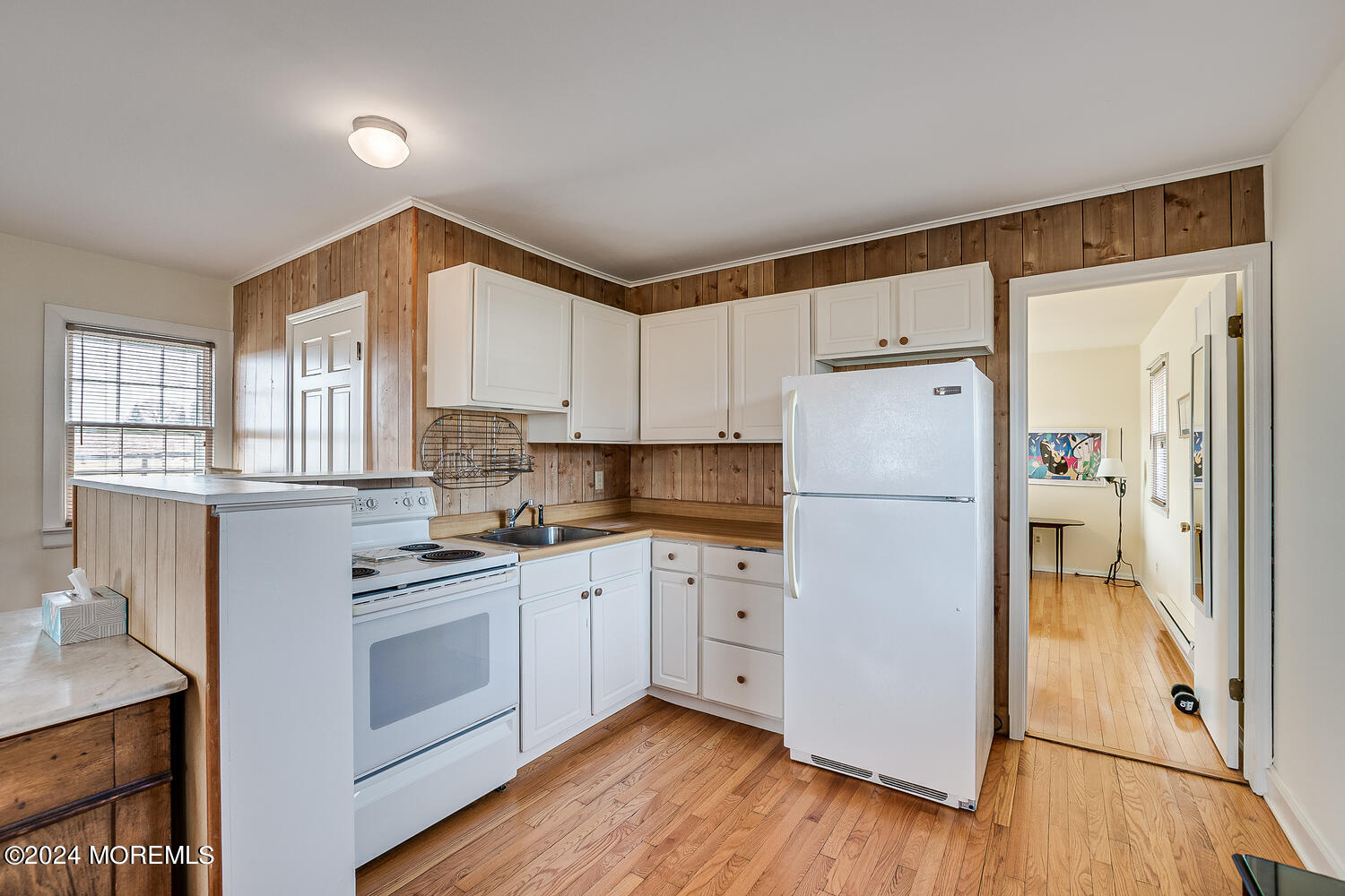 299 County Road 537 Colts Neck, NJ 07722 - Photo 44 of 62 a kitchen with white cabinets and white appliances