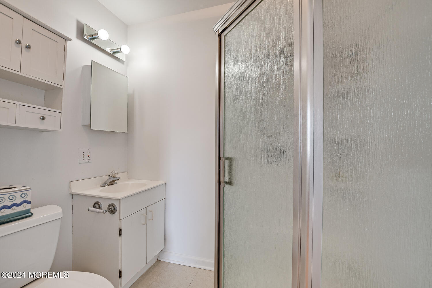 299 County Road 537 Colts Neck, NJ 07722 - Photo 46 of 62 a bathroom with a sink toilet vanity and shower