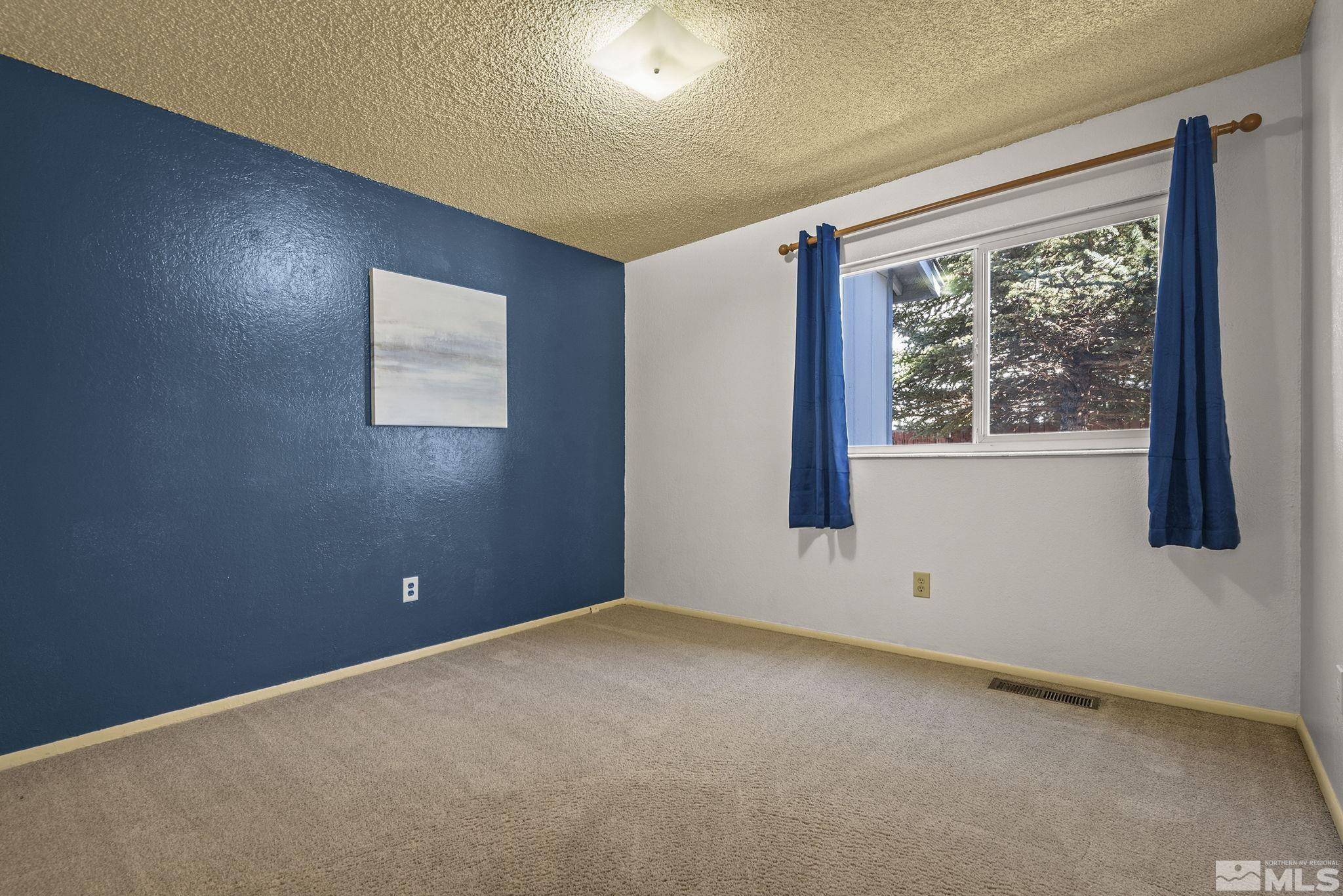 1958 Fieldcrest Drive Sparks, NV 89434 - Photo 15 of 22 a view of an empty room with a window