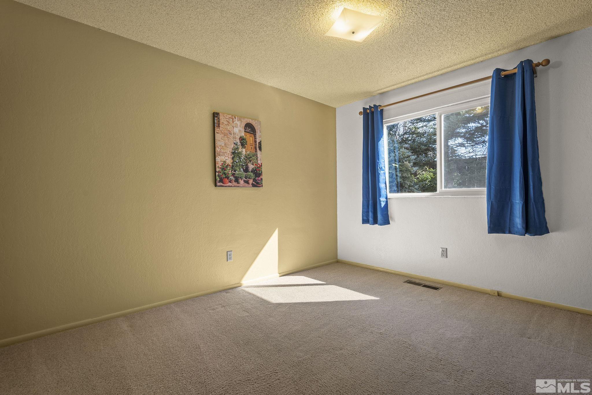 1958 Fieldcrest Drive Sparks, NV 89434 - Photo 16 of 22 an empty room with windows