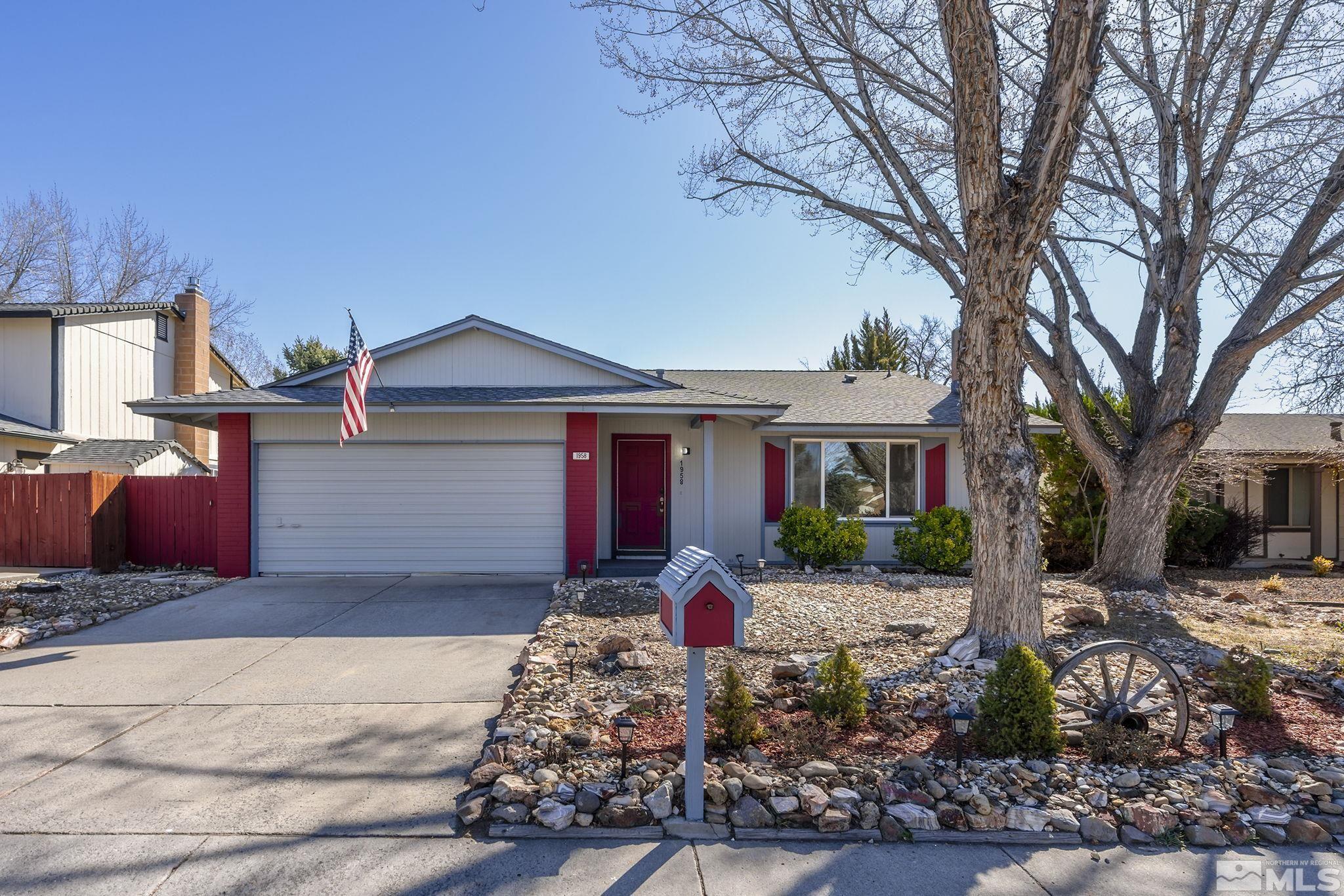 1958 Fieldcrest Drive Sparks, NV 89434 - Photo 2 of 22 a front view of a house with garden