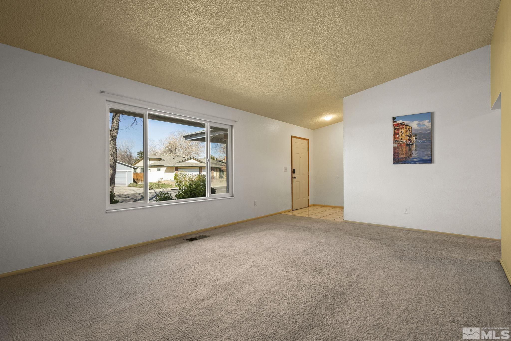 1958 Fieldcrest Drive Sparks, NV 89434 - Photo 5 of 22 an empty room with windows