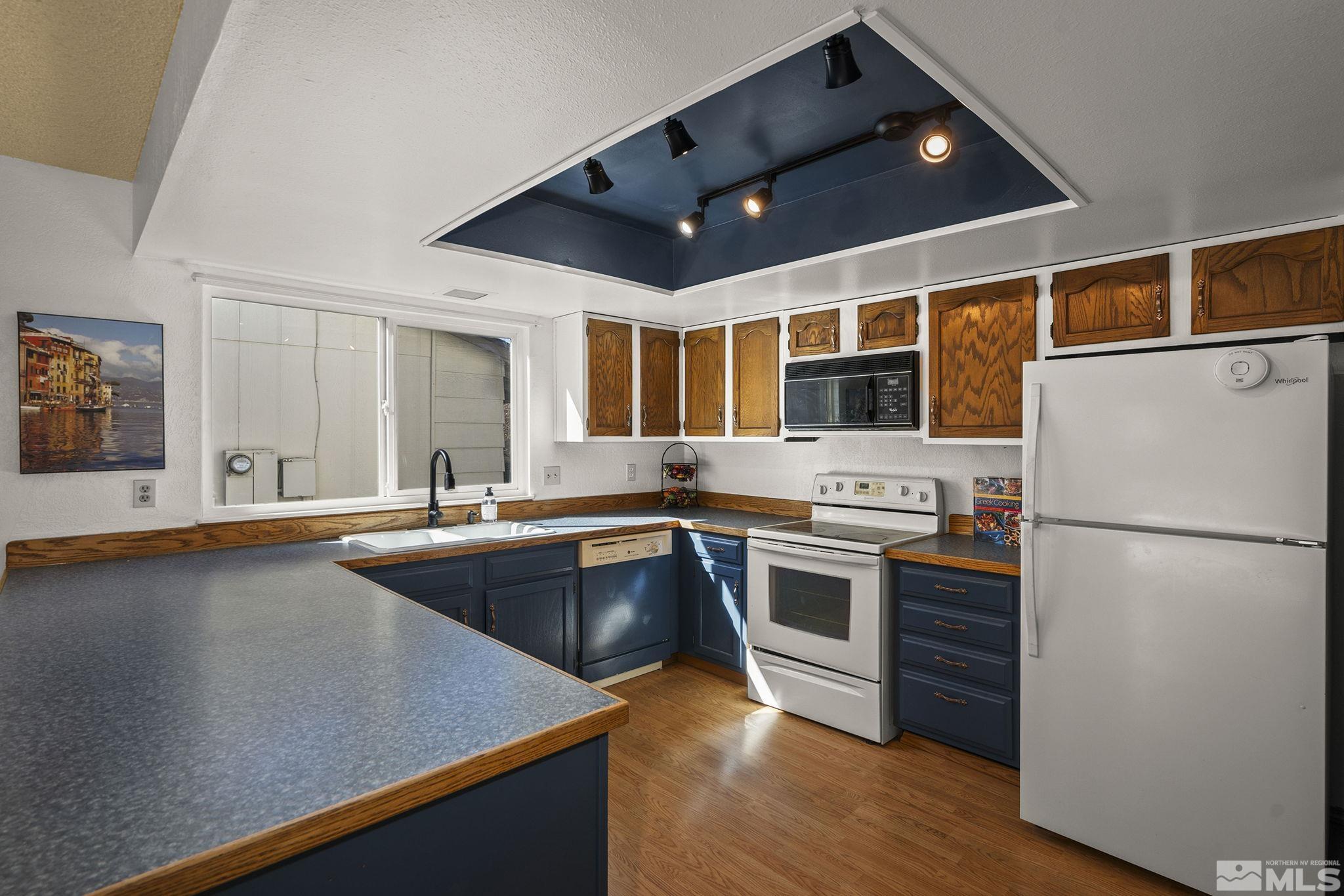 1958 Fieldcrest Drive Sparks, NV 89434 - Photo 8 of 22 a kitchen with stainless steel appliances granite countertop a refrigerator and a sink