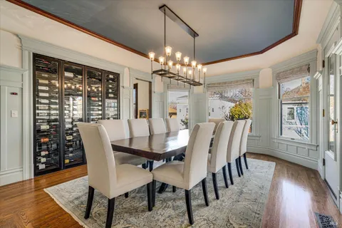 a kitchen with stainless steel appliances a stove and white cabinets