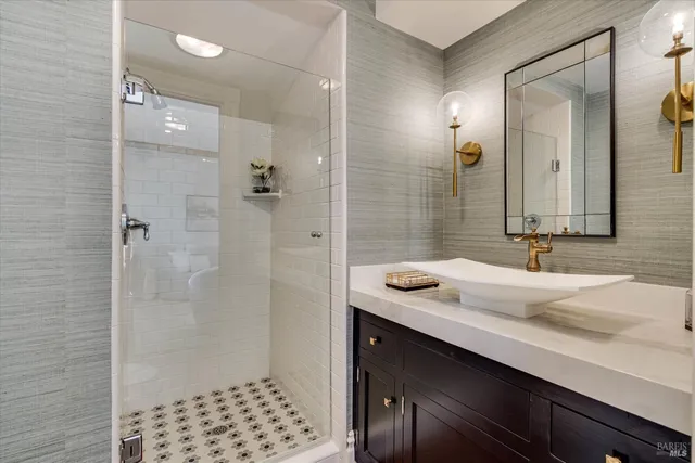 a view of a hallway with entryway wooden floor and windows