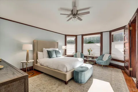 a bedroom with a bed and a chandelier