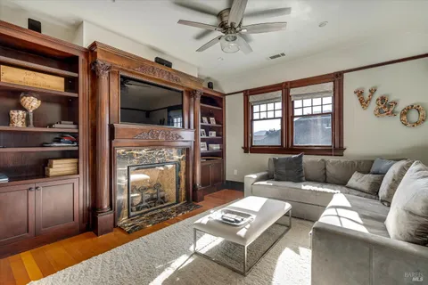 a view of a livingroom with furniture and window
