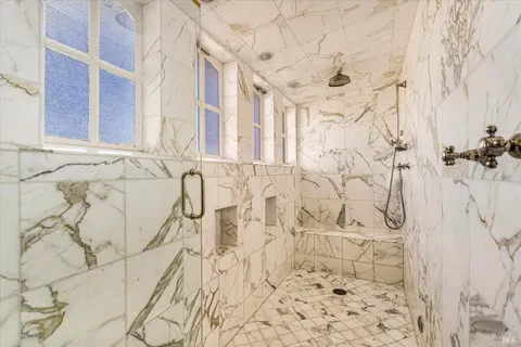 a bed room with a bed and a chair