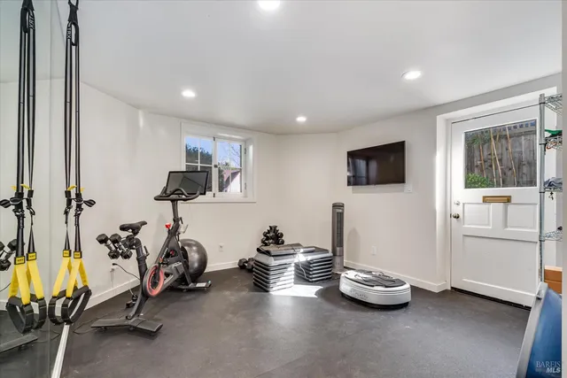 a view of a patio with a table and chairs