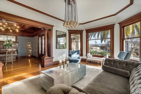 a dining room with furniture and a window