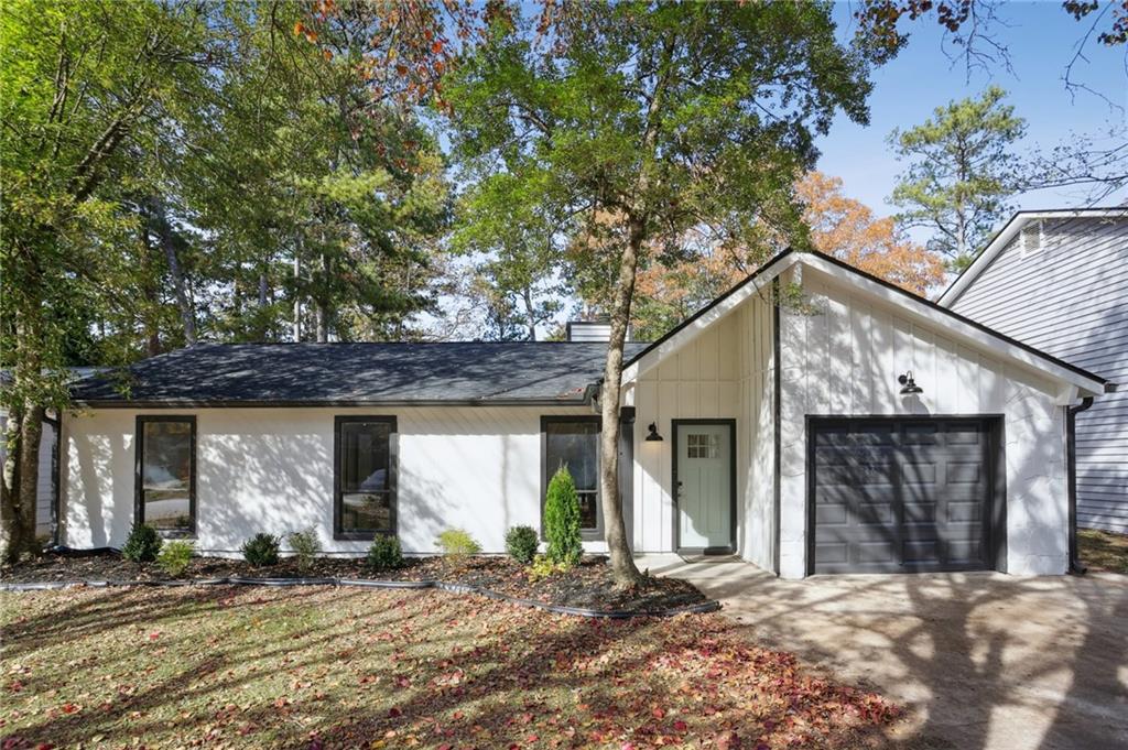 5457 Rails Way Norcross, GA 30071 - Photo 1 of 30 a front view of a house with a tree in front