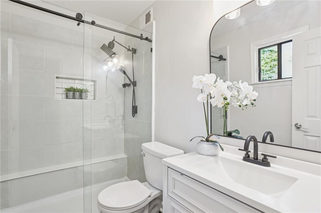 5457 Rails Way Norcross, GA 30071 - Photo 16 of 30 a bathroom with a sink toilet and shower