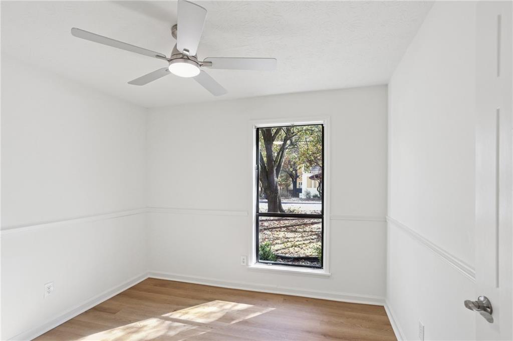 5457 Rails Way Norcross, GA 30071 - Photo 17 of 30 an empty room with a window and a fan