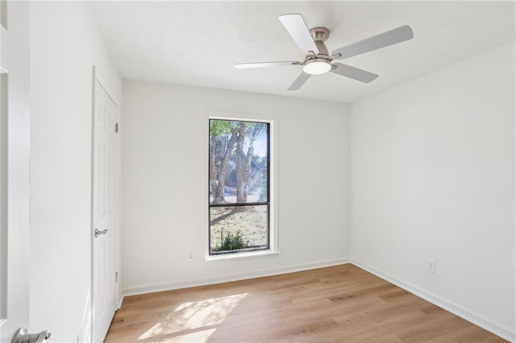 5457 Rails Way Norcross, GA 30071 - Photo 18 of 30 an empty room with windows and fan