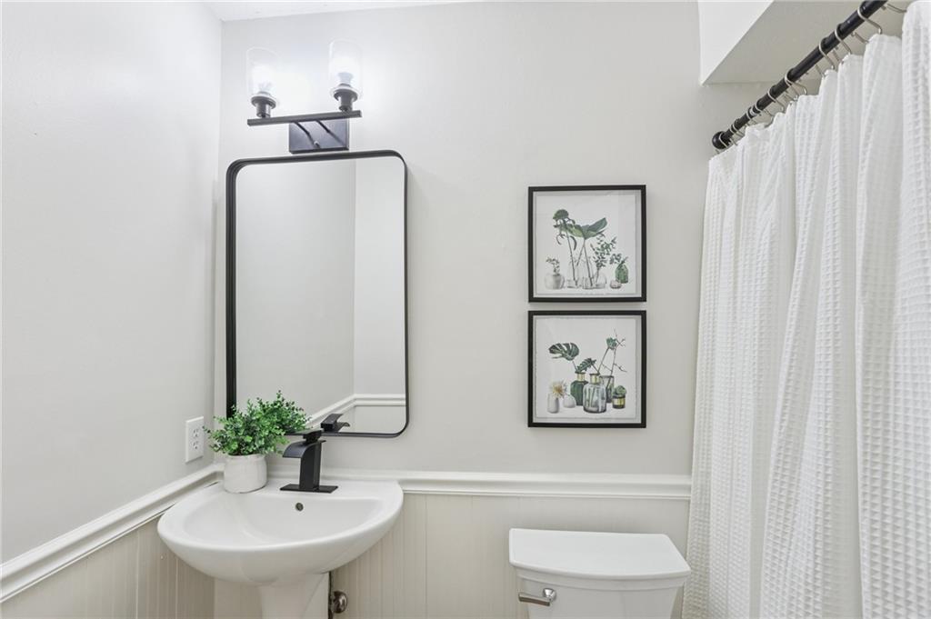 5457 Rails Way Norcross, GA 30071 - Photo 19 of 30 a bathroom with a toilet and a sink
