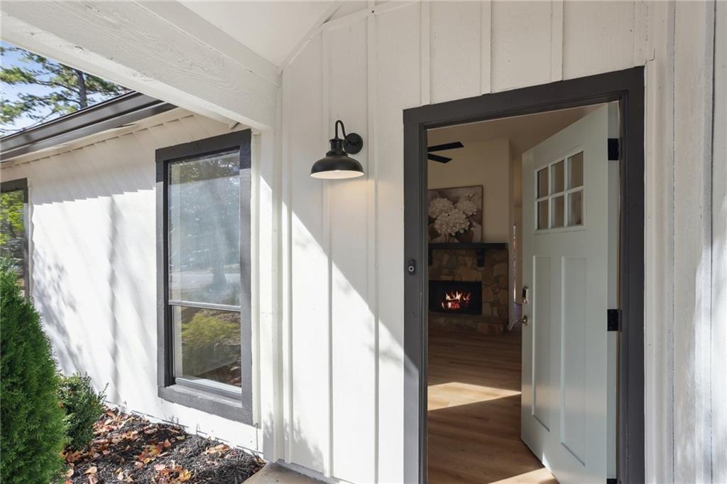 5457 Rails Way Norcross, GA 30071 - Photo 2 of 30 a view of a hallway with wooden floor and a glass door