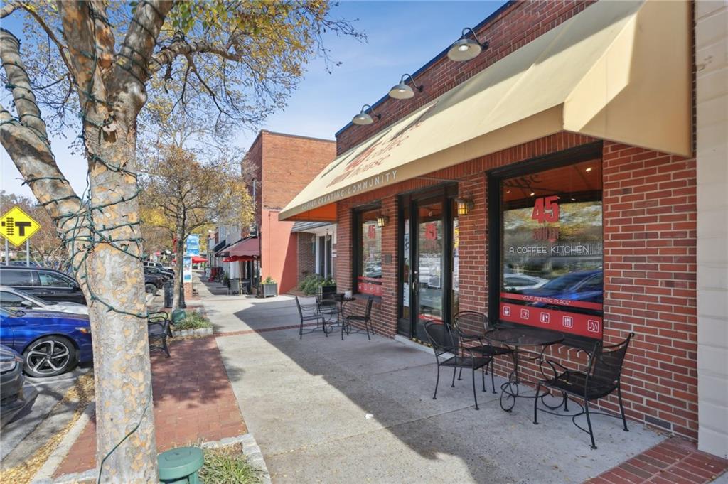5457 Rails Way Norcross, GA 30071 - Photo 27 of 30 a building outdoor space with patio furniture and potted plants