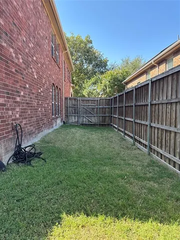 a view of a backyard with a small cabin
