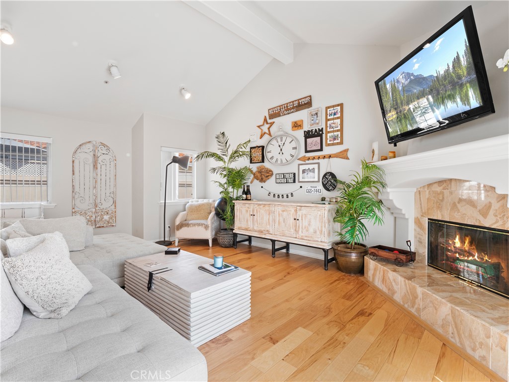 2517 Rockefeller Lane, Unit B Redondo Beach, CA 90278 - Photo 3 of 36 a living room with furniture and a fireplace
