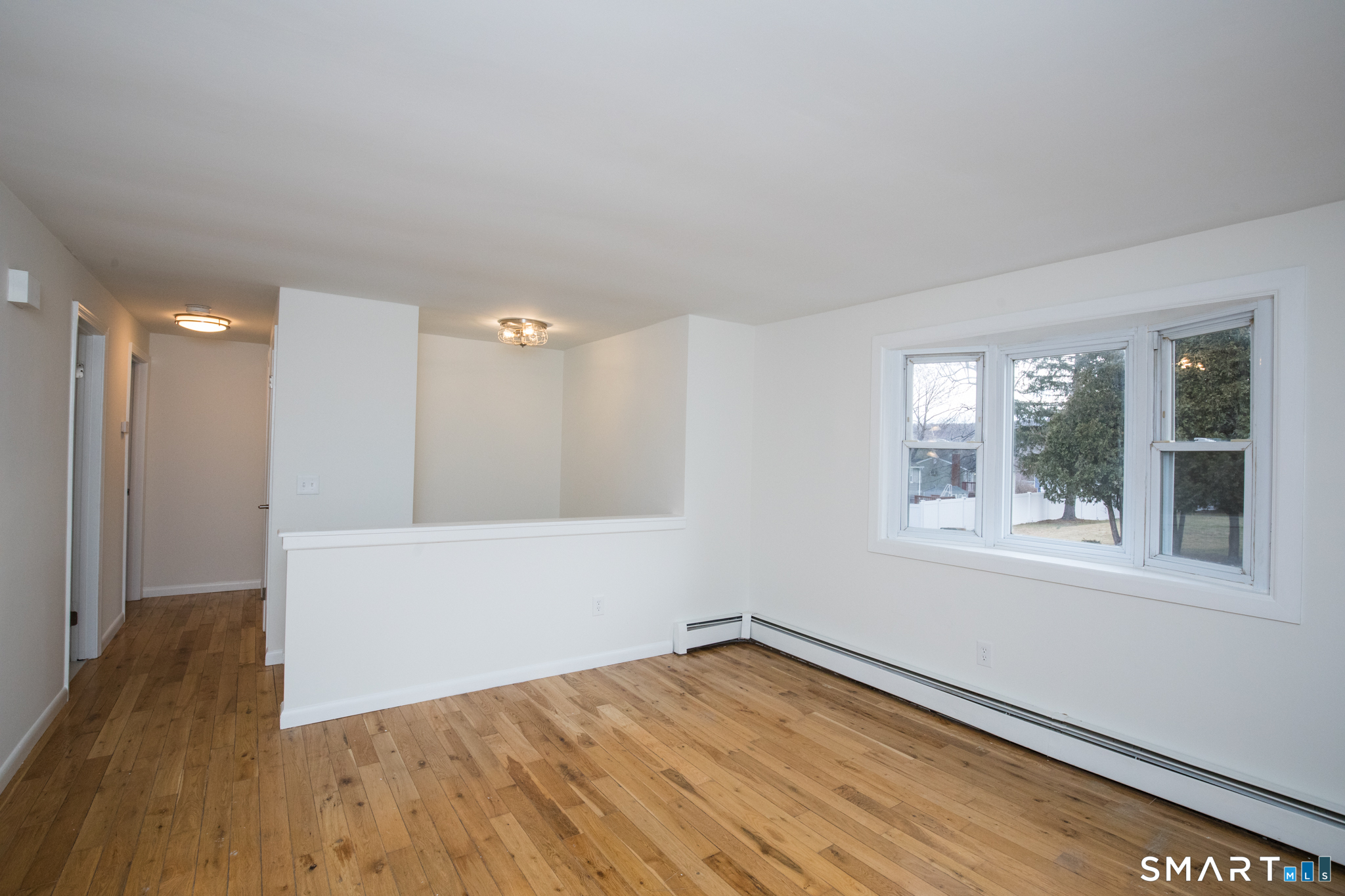291 Cartpath Drive Meriden, CT 06450 - Photo 14 of 30 wooden floor in an empty room with a window