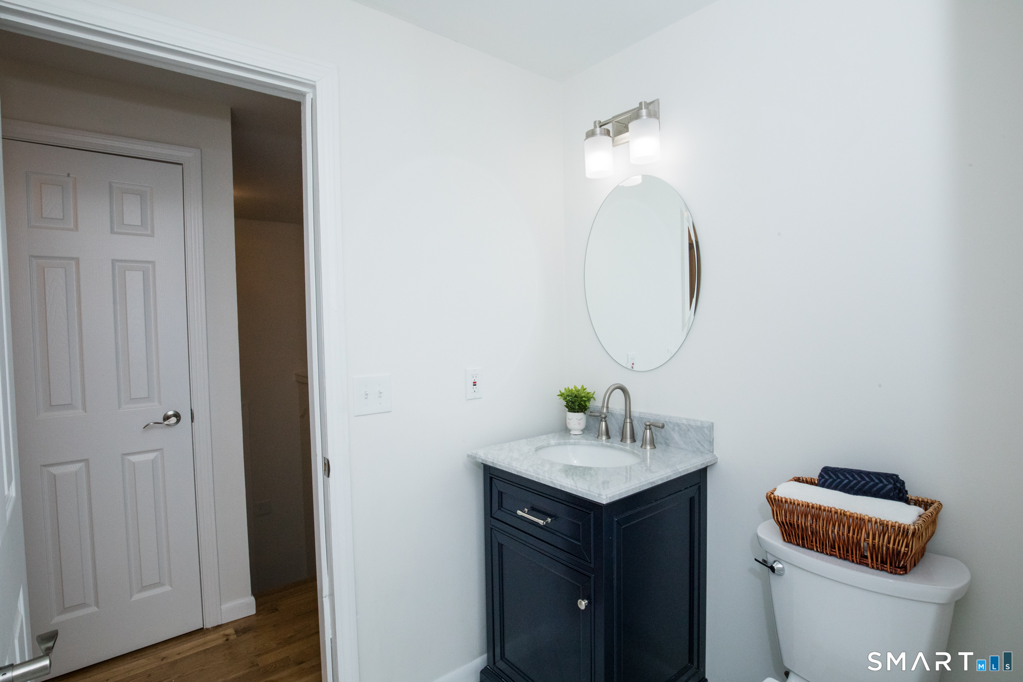 291 Cartpath Drive Meriden, CT 06450 - Photo 17 of 30 a bathroom with a sink vanity and a toilet