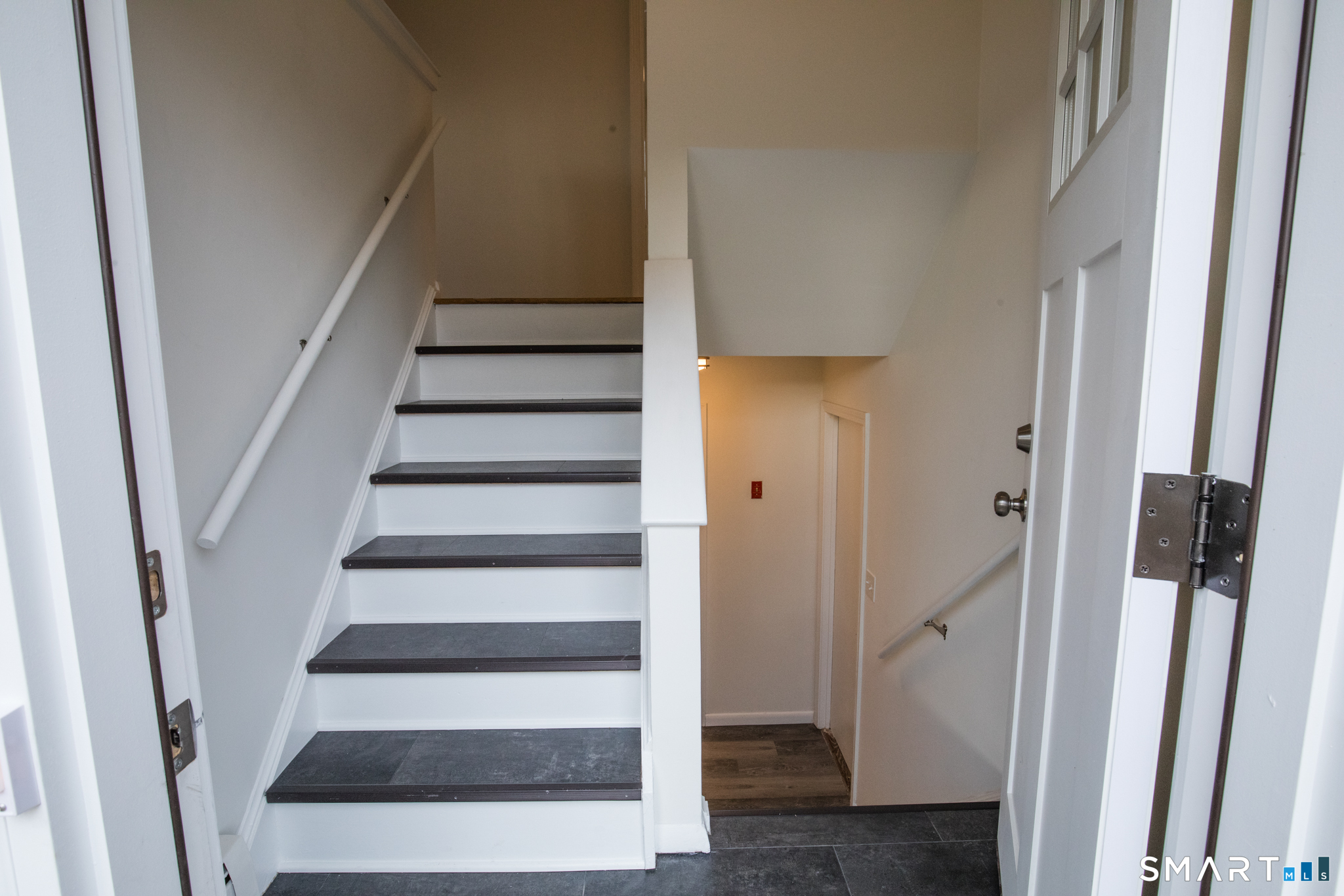 291 Cartpath Drive Meriden, CT 06450 - Photo 2 of 30 a view of staircase with white walls and windows