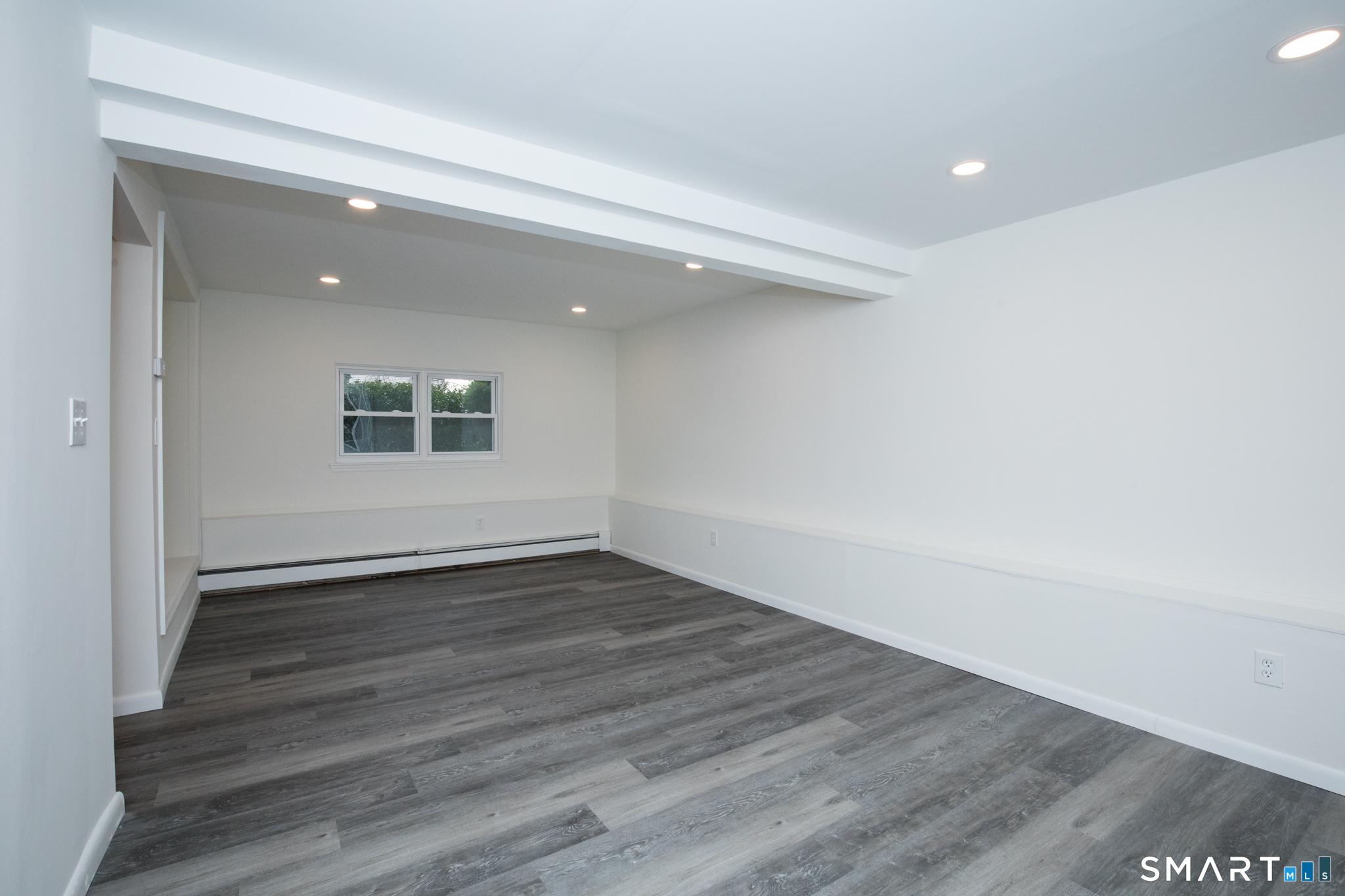 291 Cartpath Drive Meriden, CT 06450 - Photo 24 of 30 a view of an empty room with wooden floor and a window