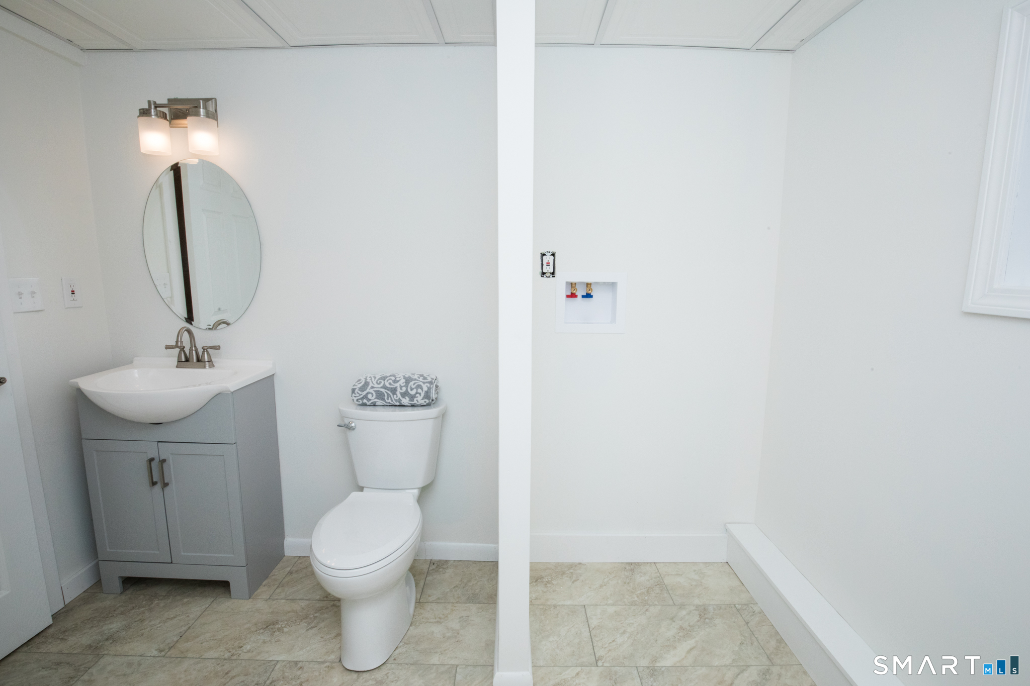 291 Cartpath Drive Meriden, CT 06450 - Photo 26 of 30 a bathroom with a toilet sink and mirror