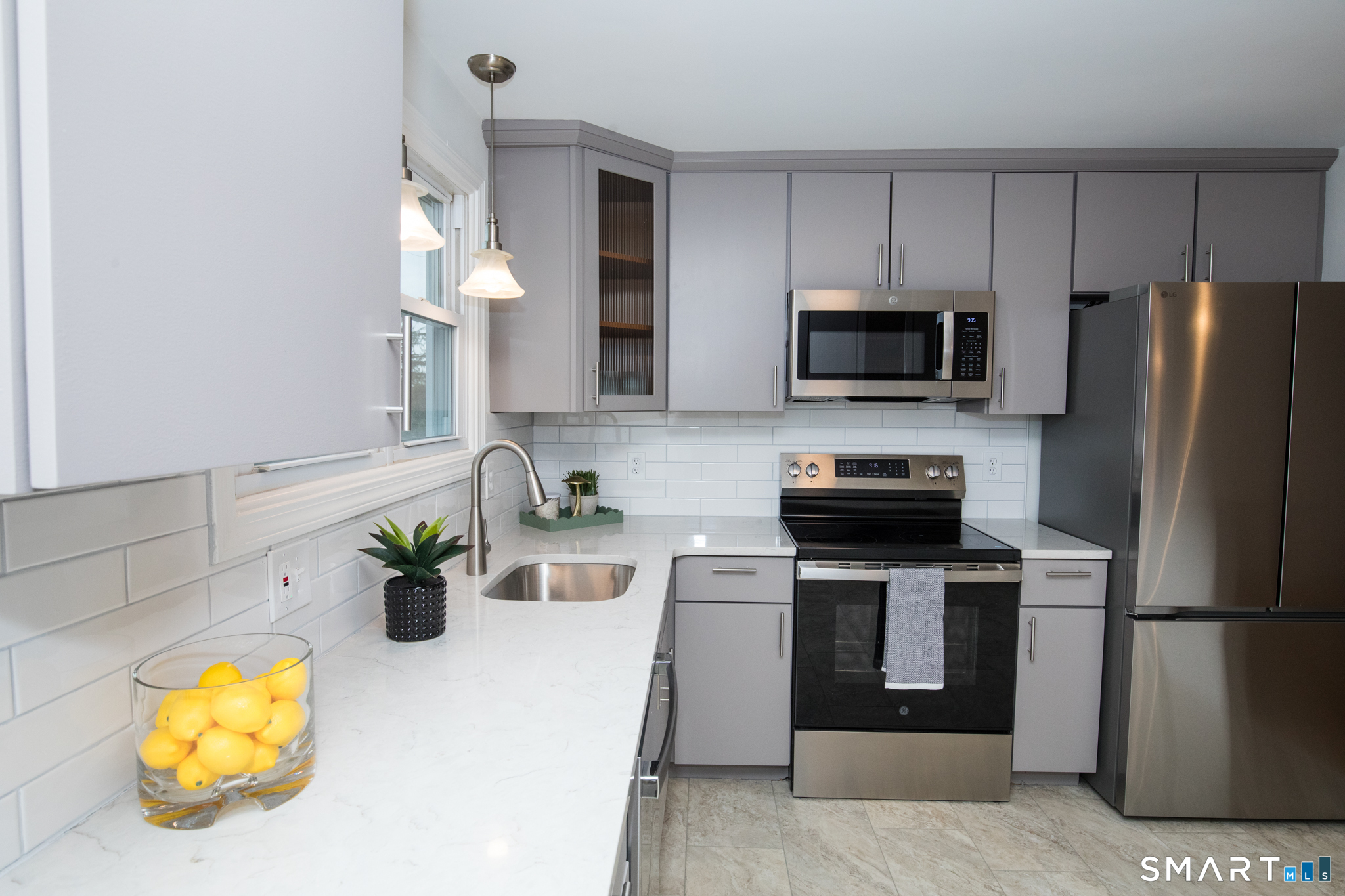 291 Cartpath Drive Meriden, CT 06450 - Photo 7 of 30 a kitchen with appliances a sink and cabinets