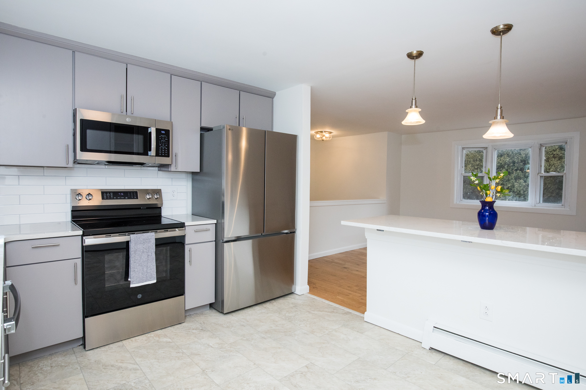 291 Cartpath Drive Meriden, CT 06450 - Photo 10 of 30 a kitchen with kitchen island a counter space a sink and appliances