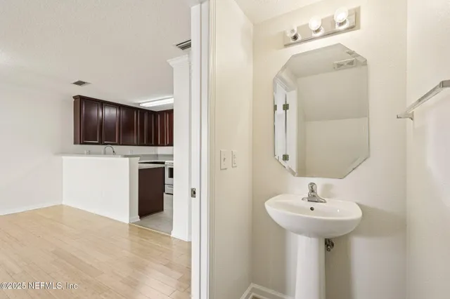 a bathroom with a sink and a mirror