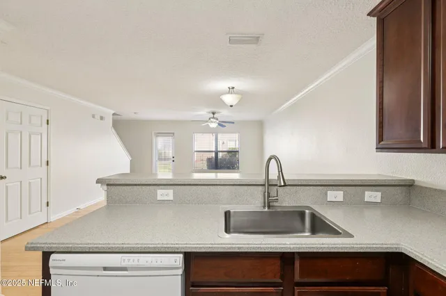 a kitchen with a sink and cabinets