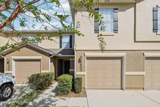front view of a house with a parking area