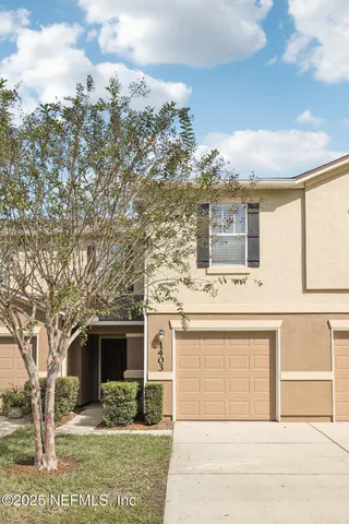 a front view of a house with yard