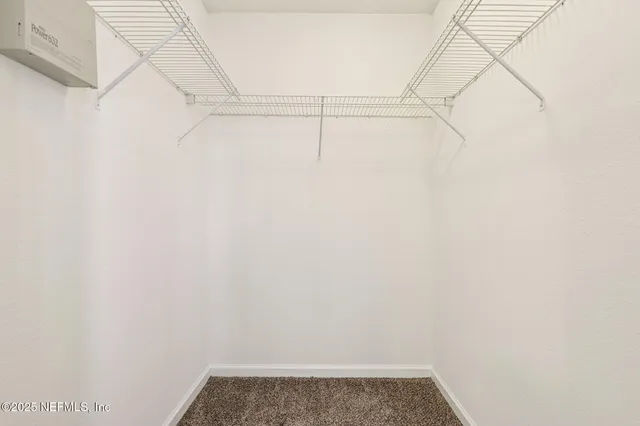 a view of small space with racks on the wall