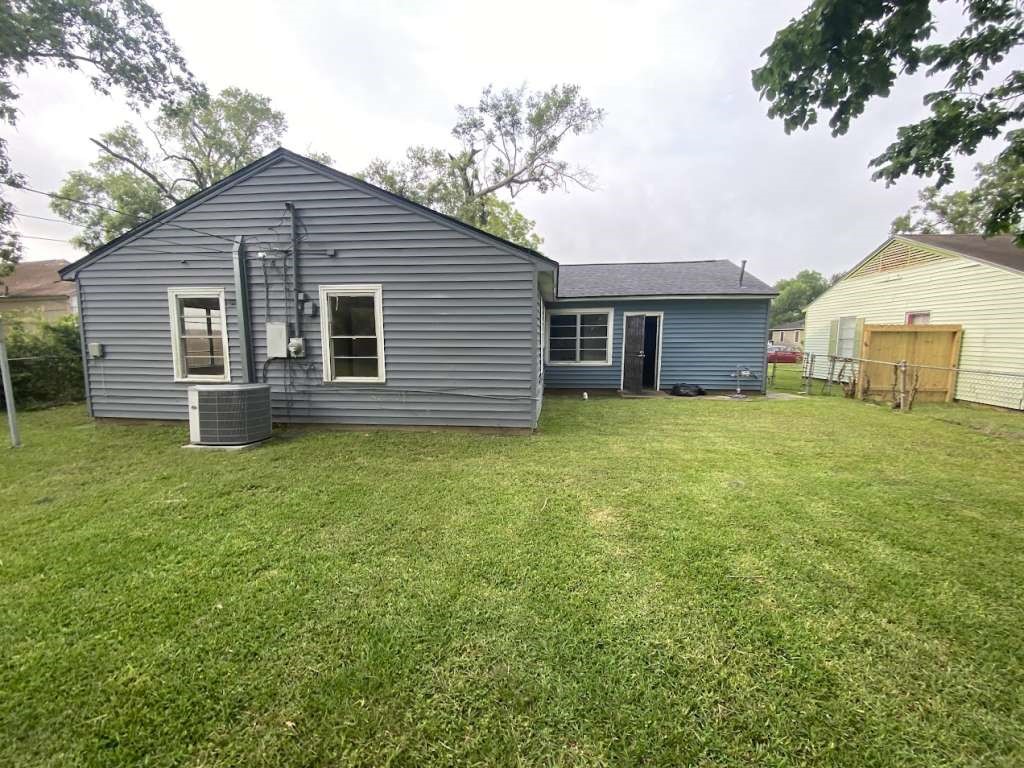 5715 Belmark Street Houston, TX 77033 - Photo 13 of 13 a view of a house with a yard