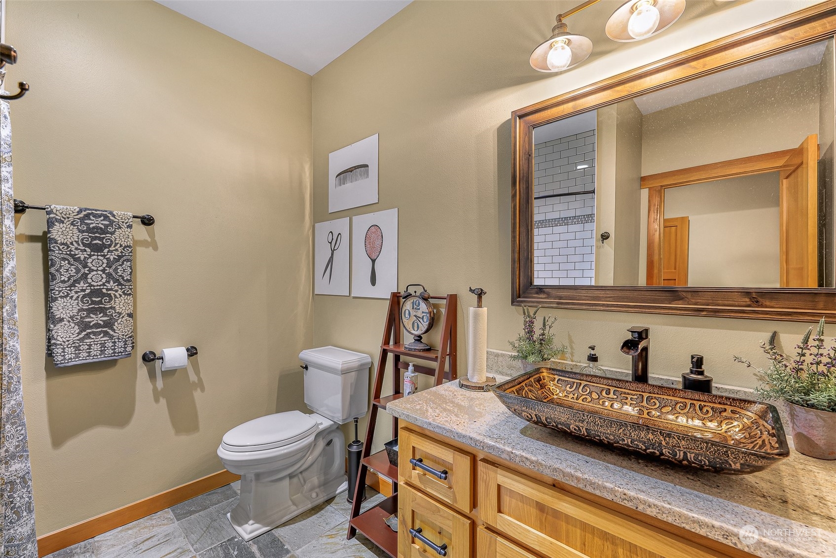 3678 Osgood Road Everson, WA 98247 - Photo 22 of 40 a bathroom with a granite countertop toilet sink and mirror