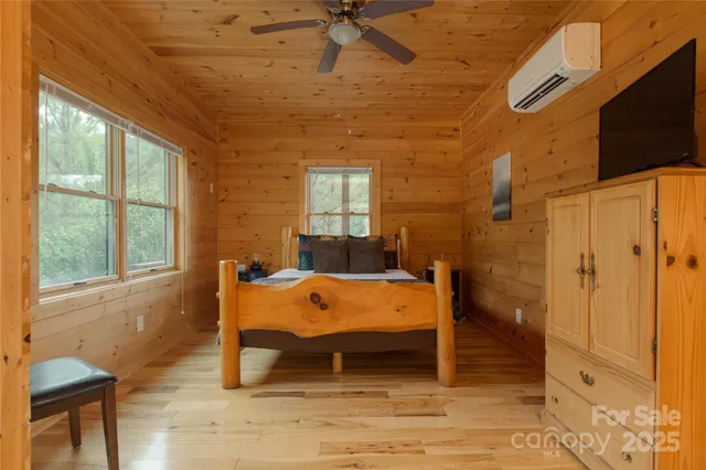 a bed sitting in a room next to a window