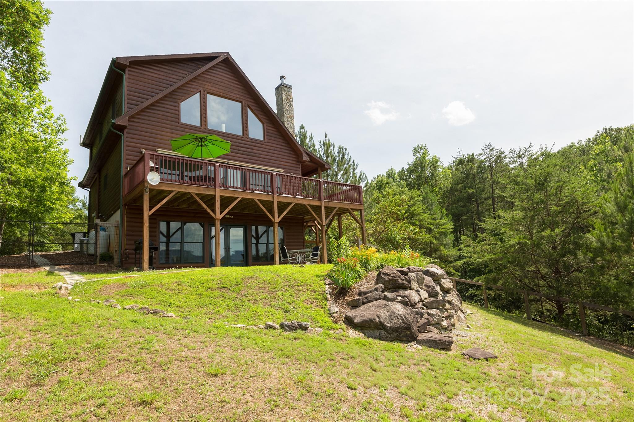 206 Legend Dr Mill Spring Mill Spring, NC 28756 - Photo 2 of 48 a view of a house with a yard