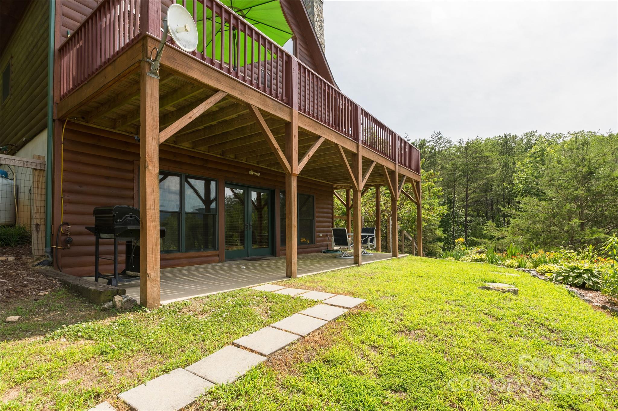 206 Legend Dr Mill Spring Mill Spring, NC 28756 - Photo 22 of 48 a view of a house with backyard and deck