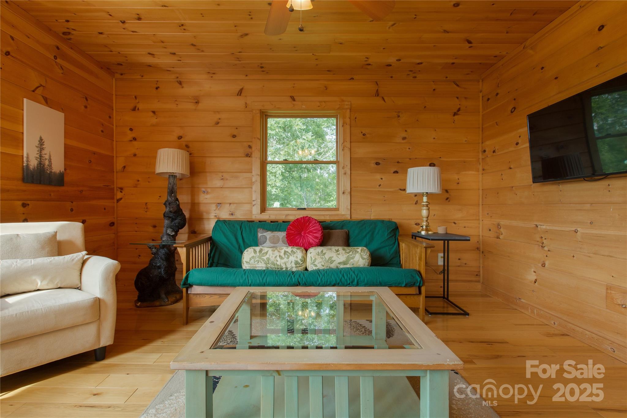 206 Legend Dr Mill Spring Mill Spring, NC 28756 - Photo 28 of 48 a living room with furniture and a flat screen tv