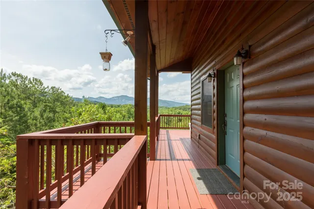 a view of a balcony with wooden floor