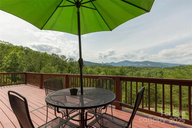 a living room with furniture rug and dining table