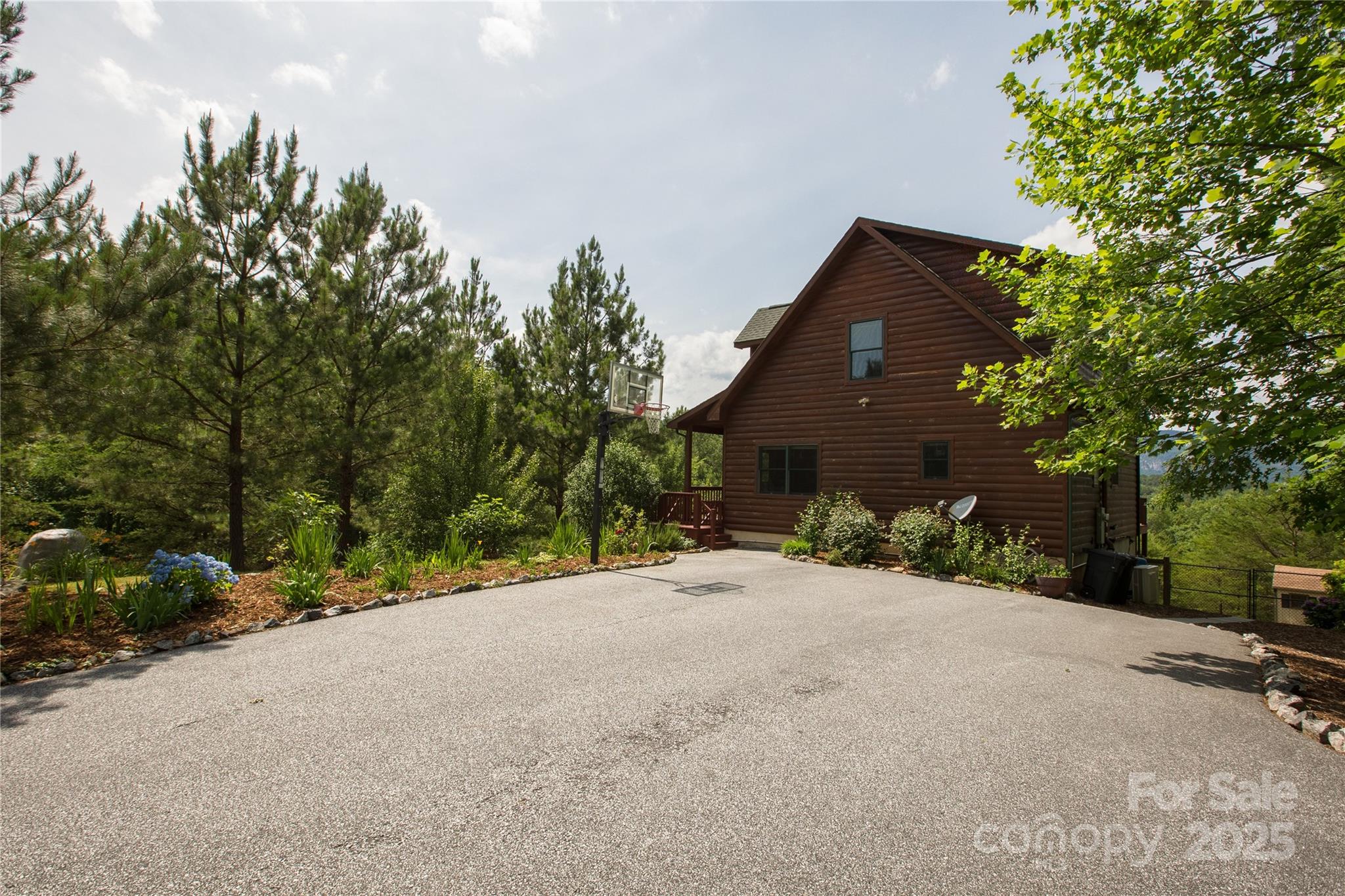 206 Legend Dr Mill Spring Mill Spring, NC 28756 - Photo 4 of 48 a view of a house with a tree and pathway
