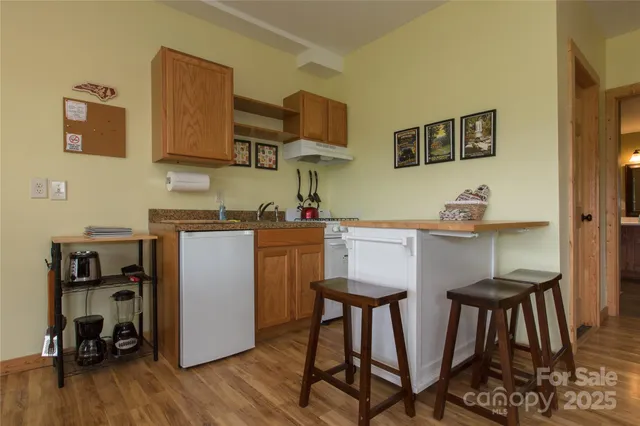 a bedroom with a bed and a mirror on dresser