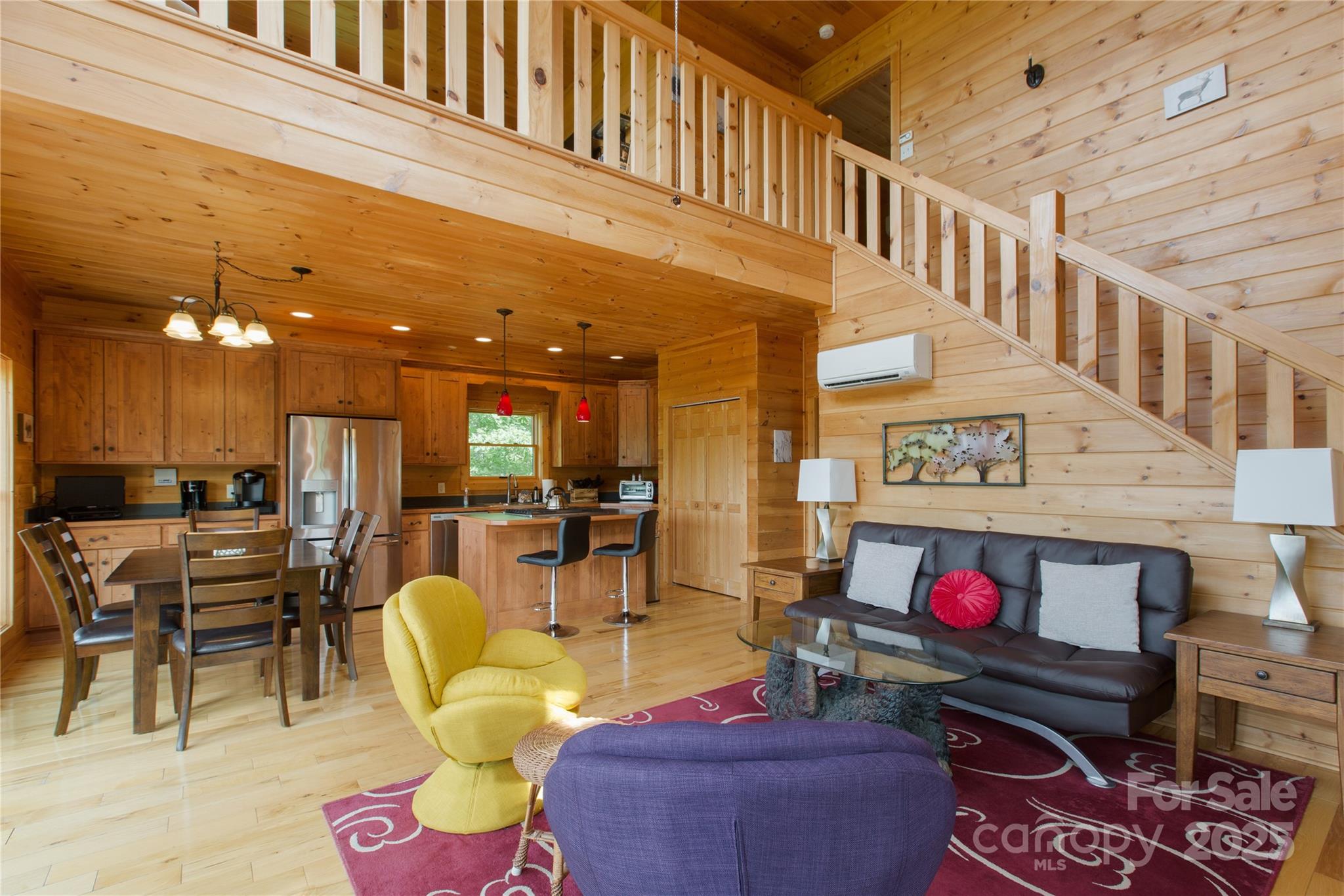 206 Legend Dr Mill Spring Mill Spring, NC 28756 - Photo 7 of 48 a living room with furniture a rug and a chandelier
