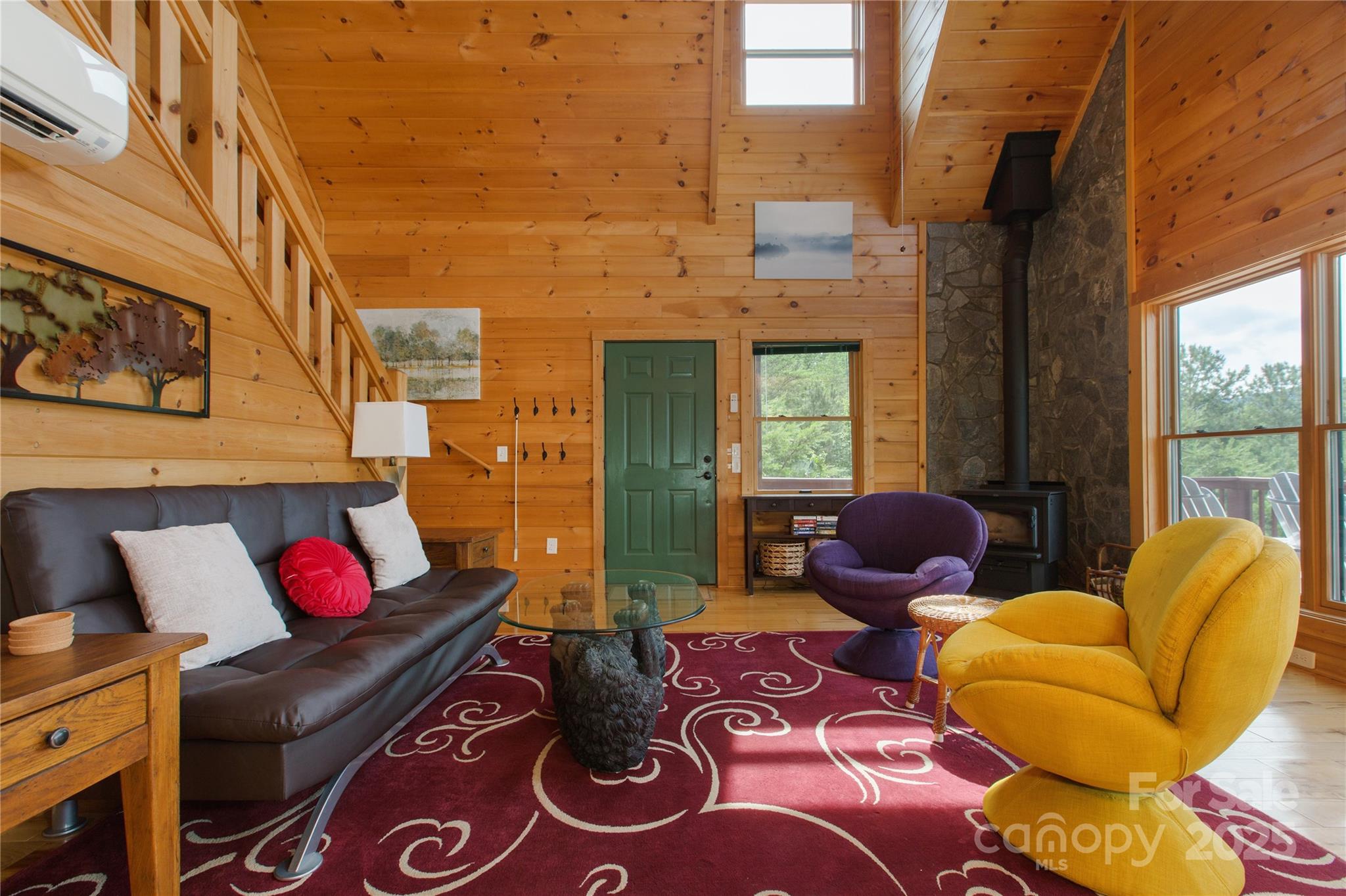 206 Legend Dr Mill Spring Mill Spring, NC 28756 - Photo 8 of 48 a living room with furniture and a floor to ceiling window