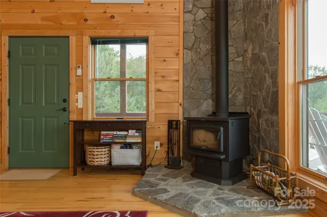 a living room with a fireplace furniture and a window